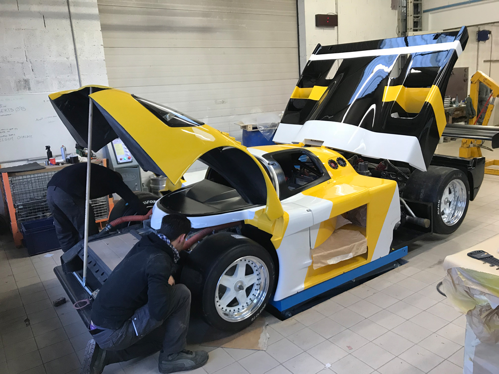 Toyota 88C reassembly: painted body panels refitted at the O-ONE workshop